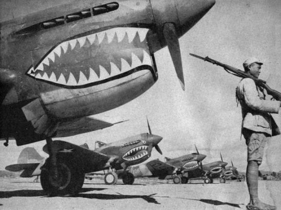  Chinese soldier guards American P-40's 
