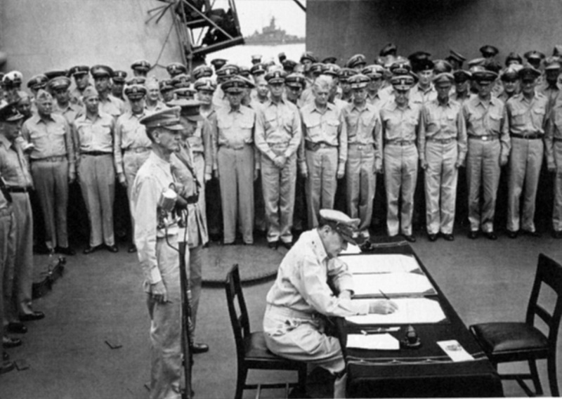  General Douglas MacArthur signs as Supreme Commander 